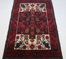 Load image into Gallery viewer, Handmade Antique, Vintage oriental Persian  Baluch rug - 178 X 100 cm
